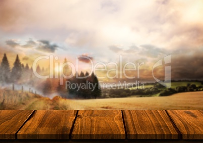 Wood table against landscape with pine trees