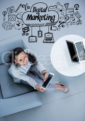 Overhead of business woman sitting with black business doodles