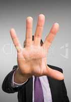 Close up of business man's hand against grey background