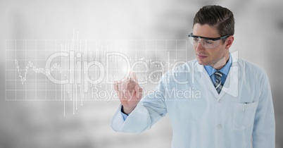 Man in lab coat and goggles pointing at white graph and flare against grey background