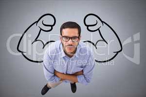 Aerial view of confident business man  against grey background with drawing of  flexing muscles