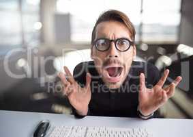 Stressed man hysterical in office