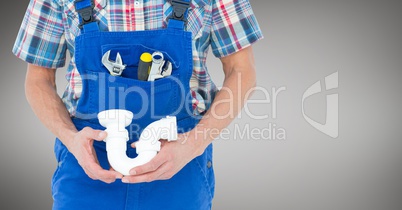 Mechanic with white pipe against grey background