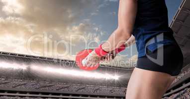 Table tennis player lower body against stadium and sky with clouds