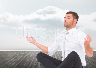 Man Meditating peaceful by clouds