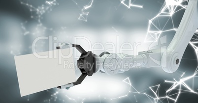 White robot claw with card and white interface against blurry grey room