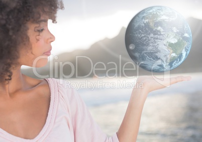Woman with open palm hand holding world earth globe