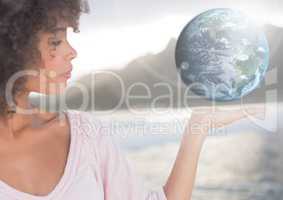 Woman with open palm hand holding world earth globe