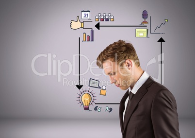 Businessman looking down with arrows and business graphic drawings