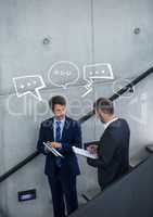 Business men on stairs with white speech bubbles