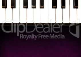 Piano keys against purple background