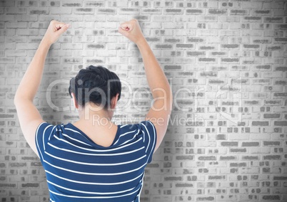 Sad angry woman grief banging fists against a wall