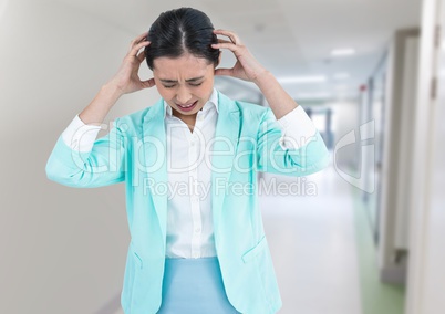 Stressed woman in corridor
