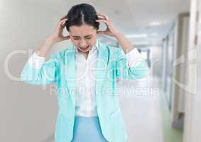 Stressed woman in corridor