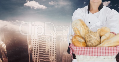 Chef with bread against blurry skyline