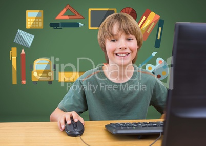 Young boy on computer with education graphic drawings