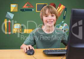 Young boy on computer with education graphic drawings