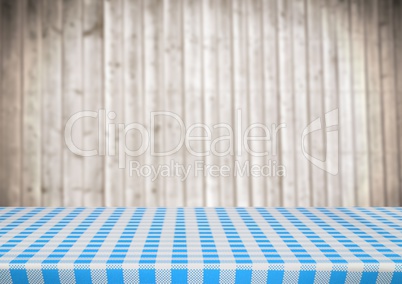 Picnic table against blurry wood panel