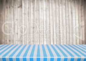 Picnic table against blurry wood panel