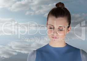 Woman Meditating peacefully by water ripple of clouds