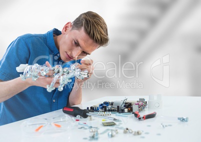 Man with electronics against blurry background
