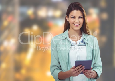 Young woman with tablet against Night city