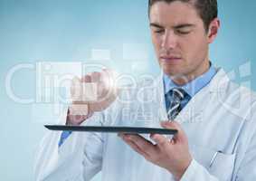 Man in lab coat holding up tablet with square interface against blue background
