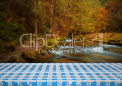 Picnic table against blurry river