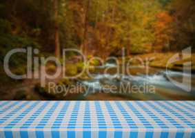 Picnic table against blurry river