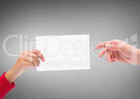 Hands with blank card against grey background