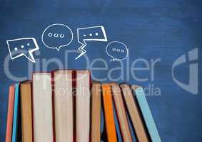 Standing books with white speech bubbles against blue chalkboard