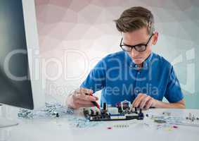 Man with electronics against green and pink vector mesh
