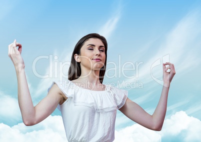 Woman Meditating peacefully with blue sky perspective