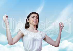 Woman Meditating peacefully with blue sky perspective