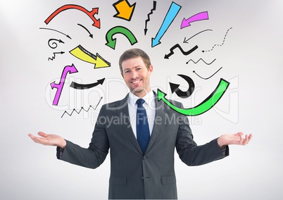 Man choosing or deciding with open palm hands and many colourful arrows around him