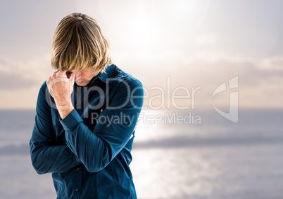 Sad depressed man in front of sea
