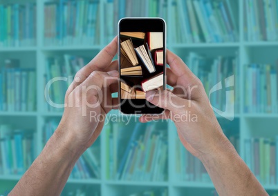 Hands with phone showing standing books against blurry bookshelf with teal overlay
