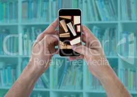 Hands with phone showing standing books against blurry bookshelf with teal overlay