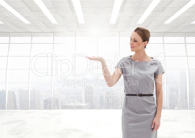 Woman with open palm hand in office