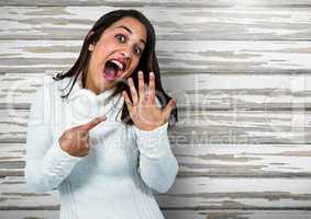 Engaged Woman with ring excited against wood