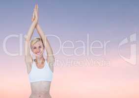 Woman Meditating peacefully yoga in twilight sky