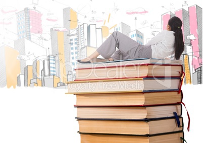 Woman lying on Books stacked by fun buildings drawings