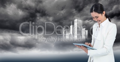 Woman in white coat with tablet and white building graphic against stormy sky