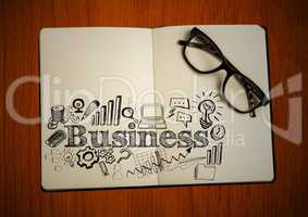 Open book with glasses and black business doodles on table
