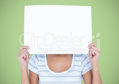 Woman with large blank card over face against green background