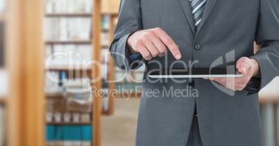 man touching tablet in Library