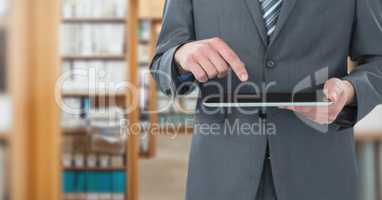 man touching tablet in Library