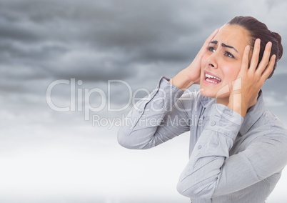 Stressed Woman by dark clouds