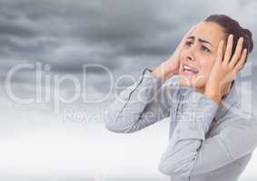 Stressed Woman by dark clouds