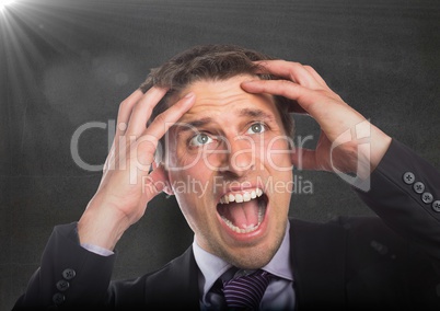 Business man hands on head against concrete wall with flare